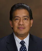 juan in a suit
