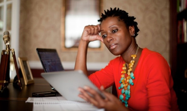 woman looking at ipad