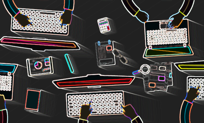 hands typing on laptops